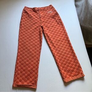 PETALS AND PEACOCKS orange butterfly print logo embroidered straight leg pants